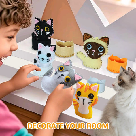 Boy playing with Cat Sewing Kit For Kids Beginners Starter Kit With Pre-Punched Felt Learn To Sew For Ages 6 To 12 Includes Five Kitten Projects Colorful Threads Safe Felt Pieces Totally DIY Gift For Girls And Boys