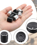 Hand holding Eight Piece Floor Lamp Dimmer Switch Knob Replacement Set Includes Four Black And Four Silver Rotary Knobs 15 x 15mm