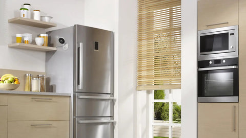 2K Indoor WiFi Security Cam With Magnetic Base And Flexible Mount in kitchen, mounted near fridge, monitoring area.