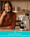 Premium Home Espresso Machine With Built In Milk Frother And Rapid Steam Wand For Bold Slick Coffee Shots Creamy Diner Style Lattes And Effortless Weekend Brews Right On Your Kitchen Counter with a woman enjoying espresso.