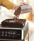 Fully Automatic Espresso Machine Featuring Intuitive Touch Display And Smooth LatteGo Milkmaker creates barista level drinks with coffee beans being poured.
