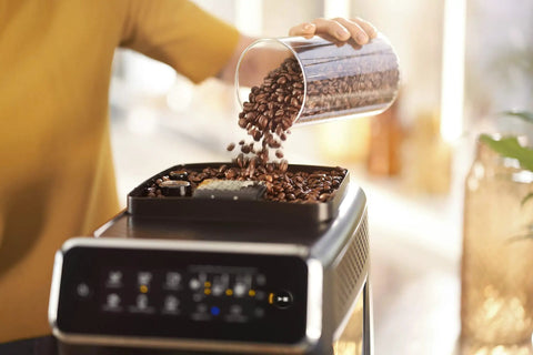 Fully Automatic Espresso Machine Featuring Intuitive Touch Display And Smooth LatteGo Milkmaker creates barista level drinks with coffee beans being poured.