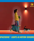 Woman walking with grocery bag and cat under light sensor, showcasing SpaceSense™ technology for motion-activated lighting.