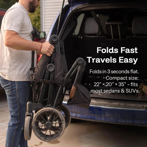 Person folding an All-Terrain Wagon Stroller For Two Kids Kid-Friendly Foldable Outdoor Beach Wagon for compact car storage.