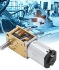 Close-up of 6V Micro Geared Motor with 100 RPM Gear Reduction for robotics, showing brass and zinc alloy gears.