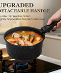 Hand holding nonstick pot with detachable handle, cooking seafood soup on stove, part of Nonstick Pots And Pans Set For RV Living 20 Pack
