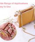 Premium Hella Tough Gold Swivel Snap Hooks With Key Rings 60 Piece Pack shown on a clear bag with a gold chain.