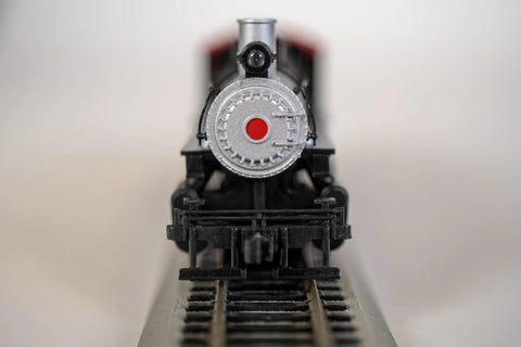 Close-up of USRA 0-6-0 Steam Locomotive With Smoke And Short Haul Tender NC And St Louis 152 HO Scale Loco on track