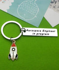Funny Aerospace Engineer Keychain Gift For Graduation And Appreciation with rocket charm on green background