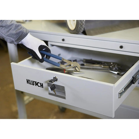Lockable storage drawer of Beefy Heavy Duty Tear Down Table Workbench with drainage, showing tools inside.