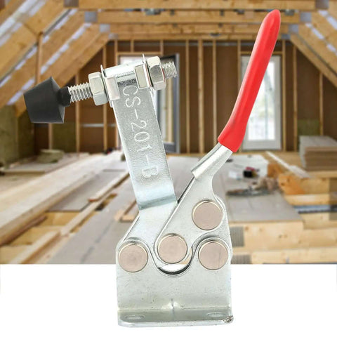 Horizontal Toggle Clamp in Carbon Steel with Electroplated Rust Proof Finish for Workbench Woodworking Welding and Stone Cutting Built to Last with Rock Solid Hold for Repeated Projects, close-up with red handle in workshop setting.