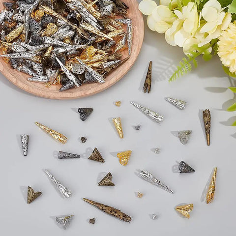 Long Flower Bead Caps Set With 520 Pcs Iron Cones And Filigree End Caps, 14 Styles, Hollow Tibetan Spacer Beads on display