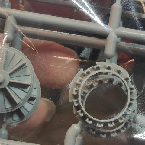 Close-up of turbine parts for F-4E Terminator Turkish Air Force 1:48 Scale Aircraft Model Kit with realistic panel lines.