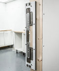 No Fuss Adjustable Door Latch And Strike Plate Router Jig featuring knockout precision mounted on wood for accurate mortise cuts.