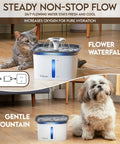 Award Winning 95oz 2.8L Pet Fountain Automatic Water Dispenser For Cats And Dogs With Replacement Filters Included Grey Plastic Multi Pet No Brainer Hydration showing flower waterfall and gentle fountain modes with a cat and a dog nearby on a wooden floor.