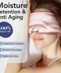 Woman wearing 100 Percent Mulberry Silk Sleep Mask For Women Adjustable Comfort Side Sleeper Friendly Full Blackout Eye Cover For All Night Sleep Travel Office Or Naps Pink lying on pillow