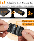 Hands holding flame-retardant 3:1 heat shrink tube from the Ultimate Battery Terminal Kit with 240 pcs copper ring lugs.
