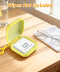 Open front view of two yellow carrying cases for lens wipes with booklet inside, glasses nearby