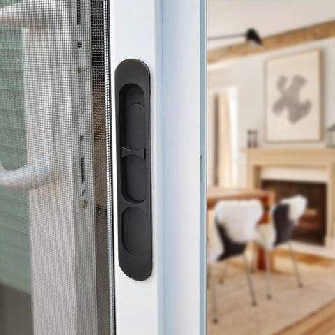 Replacement Sliding Screen Door Handle And Latch With Keeper In Black Zinc Alloy, shown installed on a sliding door indoors.