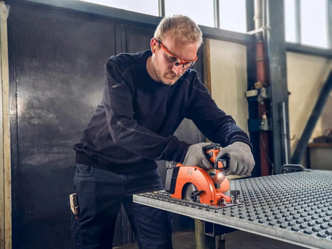 Built Tough Cordless Circular Saw For Zero Sweat Cold Cutting Sheet Metal And Pipe No Spark Action in use on metal surface.