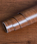 Close-up of Walnut Wood Grain Contact Paper Peel And Stick Self Adhesive Vinyl Wrap for Cabinets and Countertops roll
