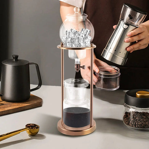 Chill Mode Ice Cold Brew Dripper Coffee Maker Featuring 600ml Borosilicate Glass And Stainless Steel Slow Drip Extraction System with ice and coffee beans.