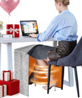 Under Desk Foot And Leg Warmer Space Heater Portable Quiet Personal Heater for home office indoor use with person at desk.