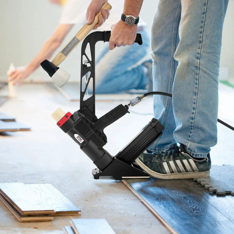 Man using Two In One Pneumatic Flooring Nailer And Stapler For Hardwood And Engineered Floors With Fifteen And A Half Gauge Staples