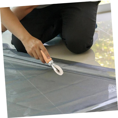Person using Window Screen Spline Roller Tool With Durable Wooden Handle For Easy Mesh Installation And Quick Repair Kit on screen frame