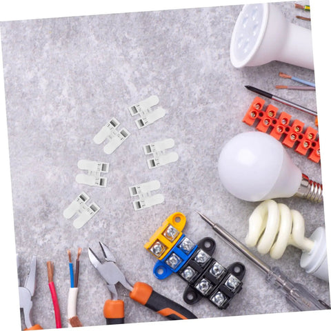 55 Piece Spring Clamp Terminal Blocks And Wire Connectors Kit for LED lighting wiring with tools on a stone surface.