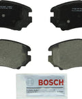 Bosch BC1421 QuietCast ceramic front brake pad set with four pads and lubricant packet