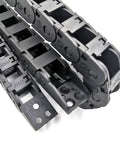 Heavy Duty 1 Meter 10x11mm Cable Drag Chain Bridge For Engraving Machines And Roller Tanks Silent Motion Transmission R28 Exterior Grade showing black plastic chain links.