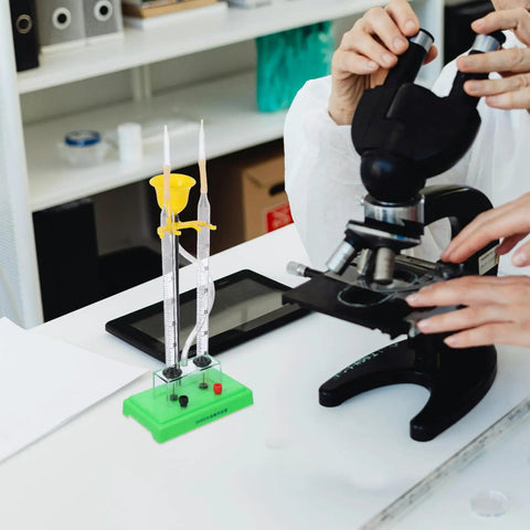Hydrogen Water Electrolyzer Hands On Electrolysis Demonstration Educational Kit beside a microscope in a science lab