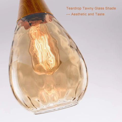 Teardrop amber glass shade from the Three Pack Teardrop Glass Pendant Lights with Adjustable Nylon Core Cables Contemporary Ceiling Fixtures