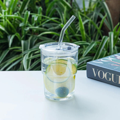 Real Deal Double Wall Glass Tumbler 13 Oz Heat Insulated Water Cup With Built Tough Glass Straw And Secure Lid For Keeping Drinks Ice Cold Or Steaming Hot Straight Fire Quality White Four Pack with lemon slices in water.