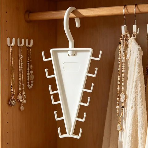 Slick V Shaped Double Sided Clothes Hanger With Twelve Hooks for Dig Free Closet Organization And Rotating Wardrobe Storage, hanging in a closet.