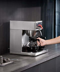 12 Cup Commercial Drip Coffee Maker With 3 Glass Carafes And 3 Warmer Plates, Stainless Steel Pour Over Brewer shown in use