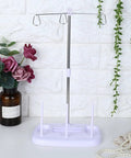 Top Tier 15 Bobbin Thread Stand For Sewing Machines, Purple frame with chrome support, ideal for organizing thread spools.