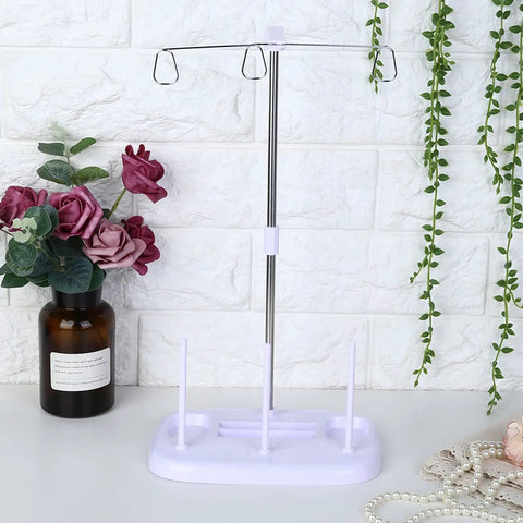 Top Tier 15 Bobbin Thread Stand For Sewing Machines, Purple frame with chrome support, ideal for organizing thread spools.