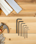 Dope Mini Metric Hex Key Tool Kit For Tiny Precision Jobs, Compact Hex Wrenches 0.7 To 3.0mm Perfect For Fixing Electronics Gadgets And Assembly Work. black metal hex keys on wooden workbench