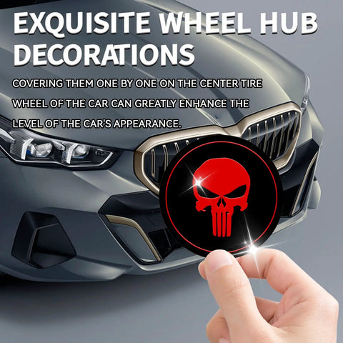 Fresh Four Pack Wheel Center Cap Stickers Featuring A Dope Skull Design In Vivid Red For Any Road Ready Ride These Two Point Two Inch Metal Emblems seen on a hand near a car's wheel.