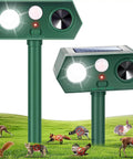 Solar Ultrasonic Animal Repellent Dual Action With Motion Sensor And Flashing Light Keeps Critters Like Squirrels Raccoons And Rabbits Out Of Your Yard And Garden Outdoor 2 Pack, two green units on stakes