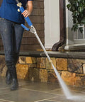 Person using Jet Nozzle Pressure Washer Hose Attachment Be a Cleaning Beast With This Power Wand For Garden Gutter Window And Car Cleaning Blue Fits Standard 3/4 Inch Hoses And 1 Inch Connectors on patio