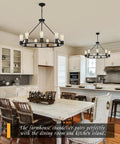 Black Wagon Wheel Chandelier Total Showstopper Lighting Fixtures Bring The Farmhouse Vibes To Your Dining Room Or Kitchen With This 9 Light Pendant over a rustic dining table.
