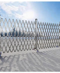 Wheeled Expandable Double Safety Gate Heavy Duty Stainless Steel Traffic Fence For Driveways And Garages Locks Down Quick No Sweat Smooth Home Security Perimeter Cover on a concrete surface.