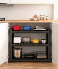 Three Tier Kitchen Storage Rack For Pots And Pans Adjustable Metal Organizer Shelf under kitchen counter, holding colorful pots and pans