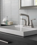 Vesna Centerset Bathroom Faucet Brushed Nickel Finish For 4 Inch 3 Hole Sinks Includes Pop Up Drain Assembly And Worry Free Drain Catch SpotShield No Fuss Sink Upgrade installed on a modern bathroom sink.