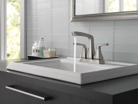 Vesna Centerset Bathroom Faucet Brushed Nickel Finish For 4 Inch 3 Hole Sinks Includes Pop Up Drain Assembly And Worry Free Drain Catch SpotShield No Fuss Sink Upgrade installed on a modern bathroom sink.