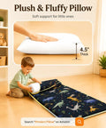 Toddler using Cozy Toddler Nap Mat With Pillow All In One Thickened Extra Large Sleeping Bag For Travel Daycare Naps Plush Minky Dot Lining And Ultra Soft Comfort Everyday with dinosaur print and 4.5-inch thick pillow.