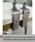 Two 304 stainless steel C-clamps, front view, with 85mm wide jaws on a desk edge